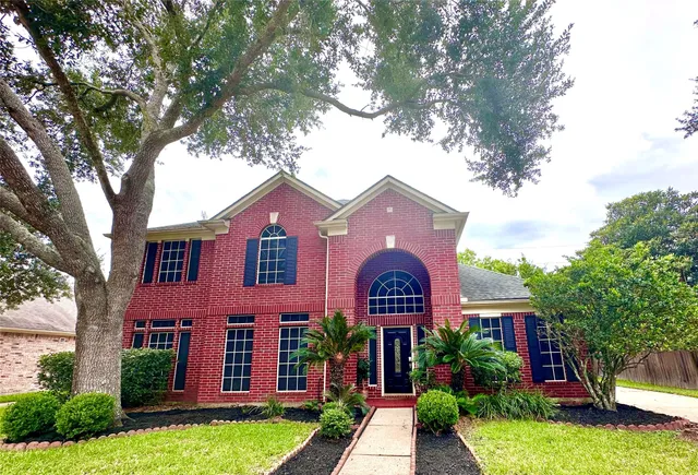 a front view of a house with yard