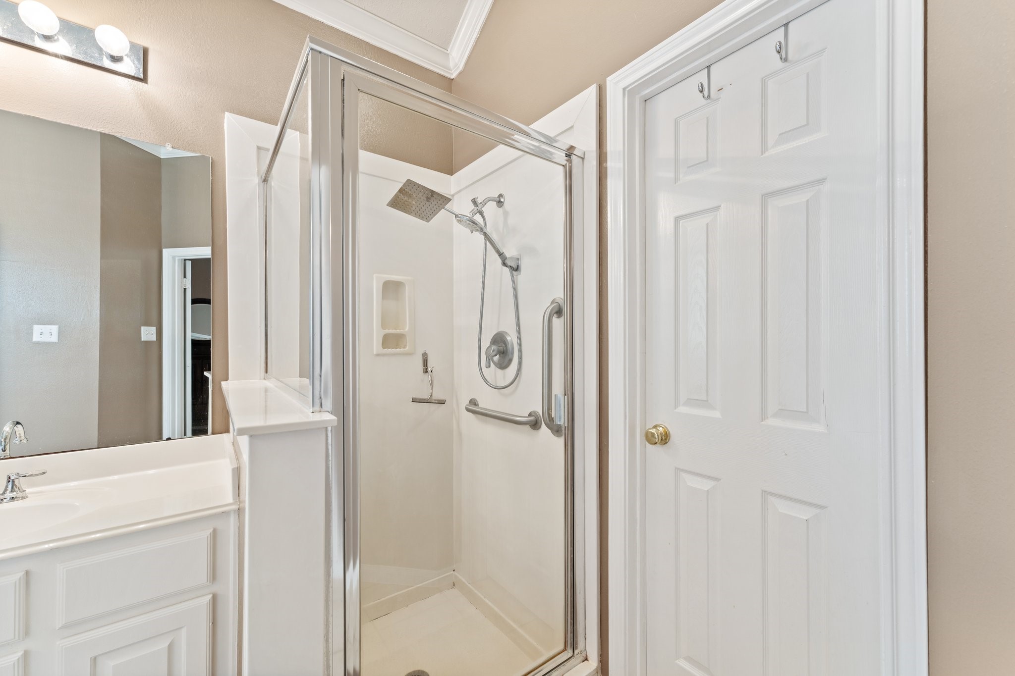 25447 China Springs Spring, TX 77373 - Photo 24 of 45 A bright, clean primary bath with updated fixtures, dual sinks, and both a soaking tub and walk-in shower for everyday convenience. A large walk-in closet is easily accessible.