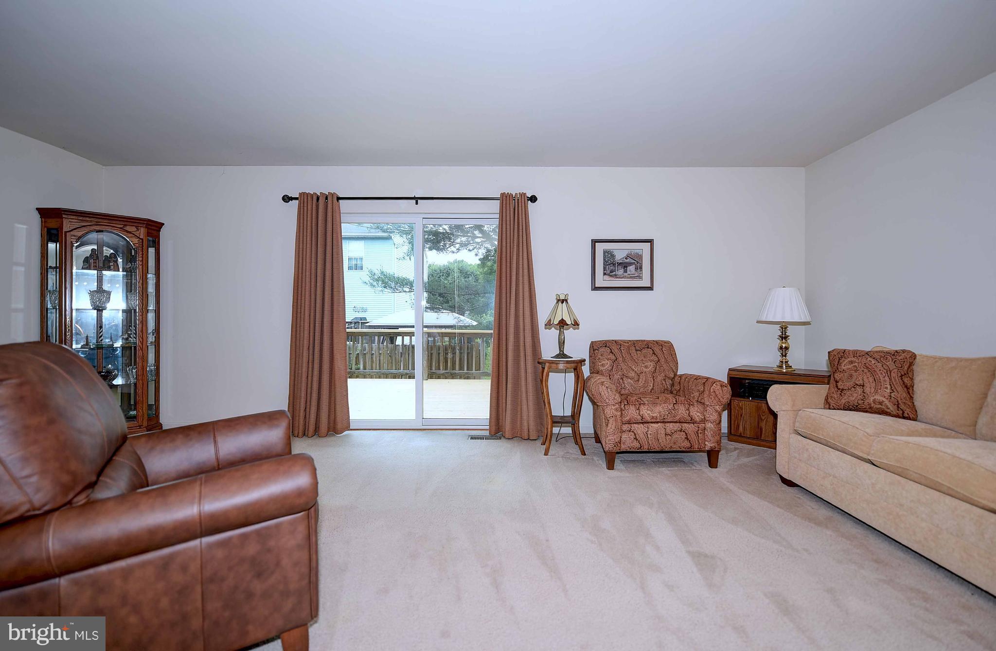 23 Offspring Court Perry Hall, MD 21128 - Photo 12 of 23 a living room with furniture and a lamp