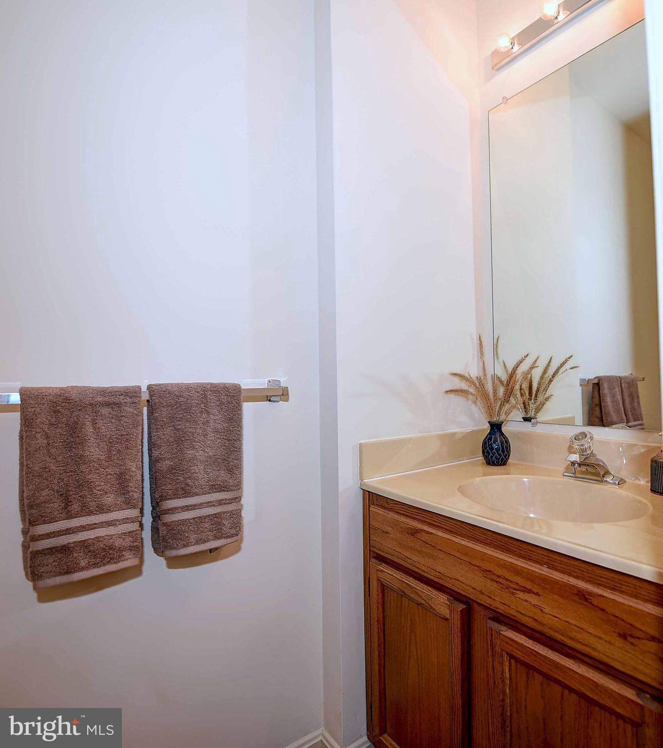 23 Offspring Court Perry Hall, MD 21128 - Photo 15 of 23 a bathroom with a sink and a mirror
