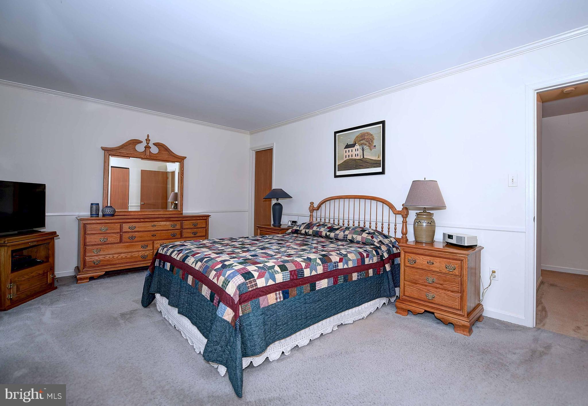23 Offspring Court Perry Hall, MD 21128 - Photo 18 of 23 a bedroom with a bed and a tv