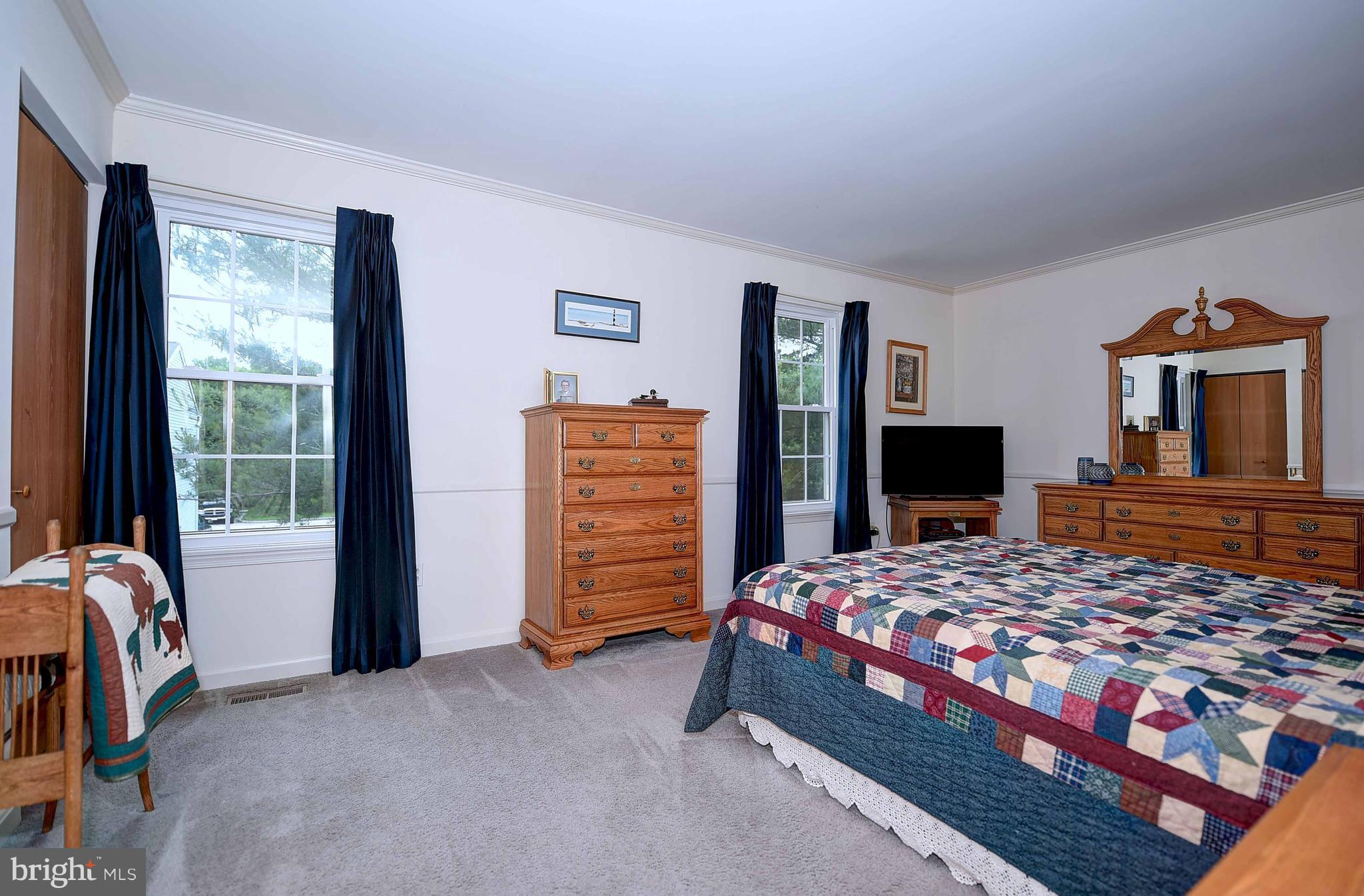 23 Offspring Court Perry Hall, MD 21128 - Photo 19 of 23 a bedroom with a bed and a flat screen tv