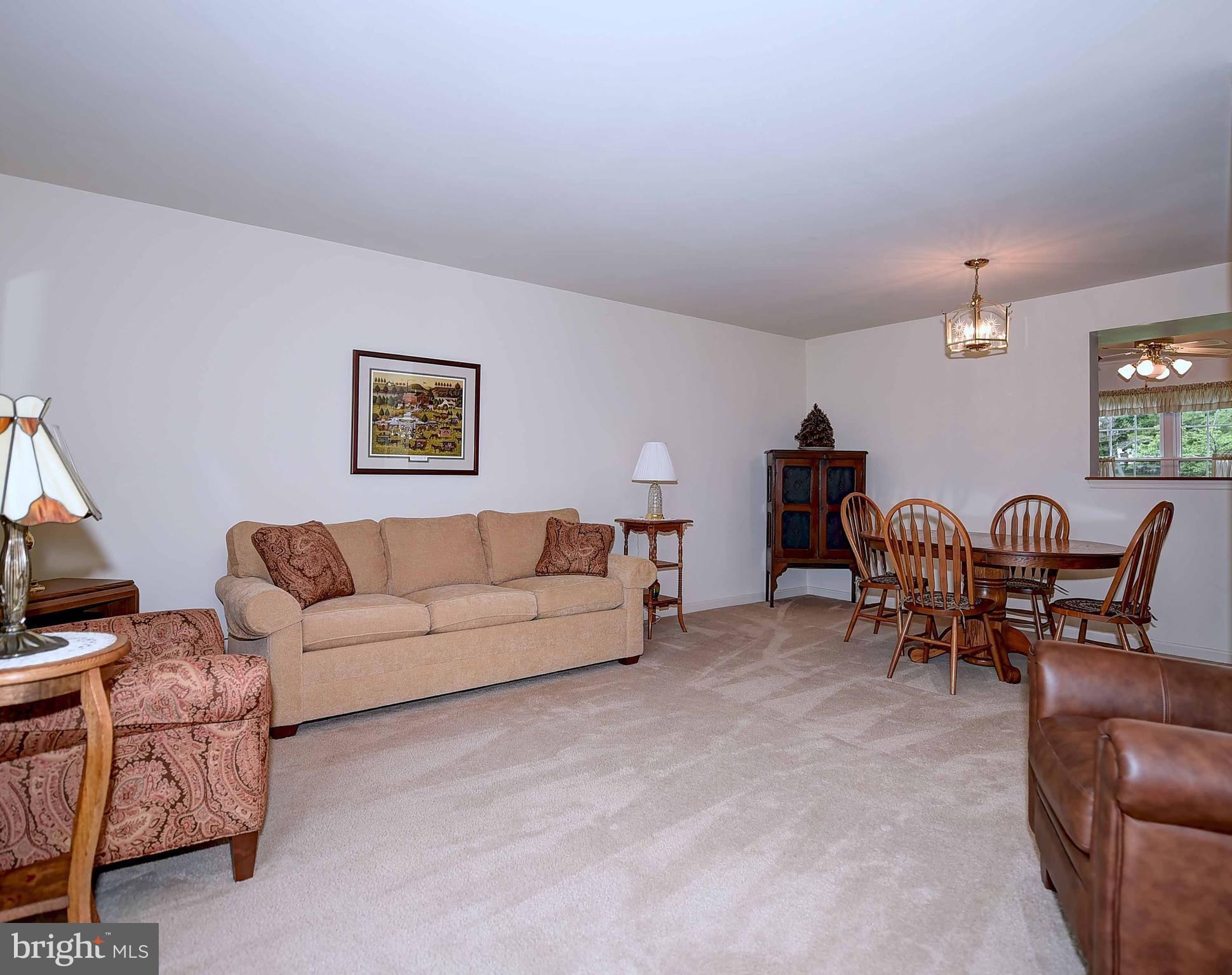 23 Offspring Court Perry Hall, MD 21128 - Photo 3 of 23 a living room with furniture and a flat screen tv