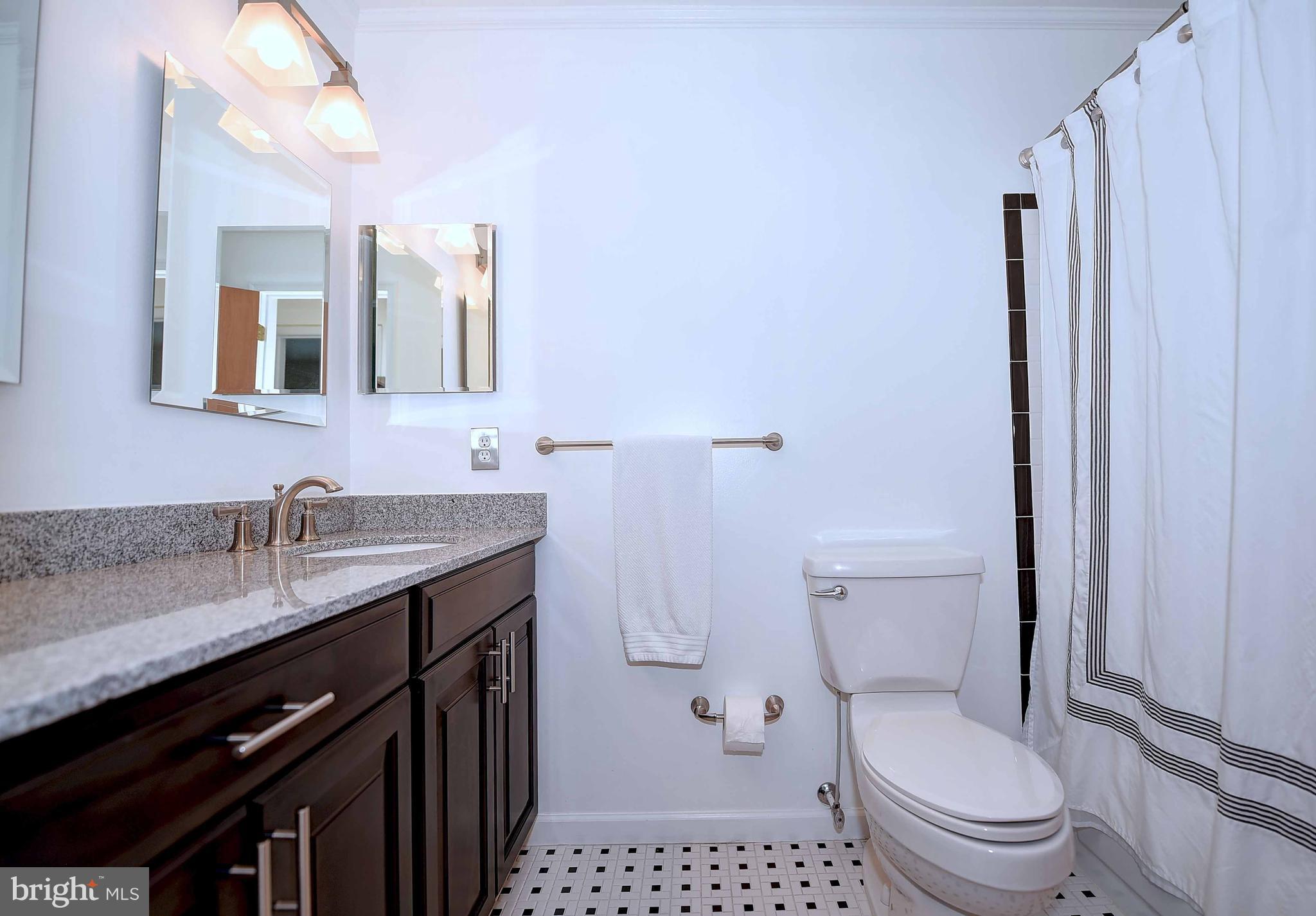 23 Offspring Court Perry Hall, MD 21128 - Photo 4 of 23 a bathroom with a granite countertop toilet sink and mirror