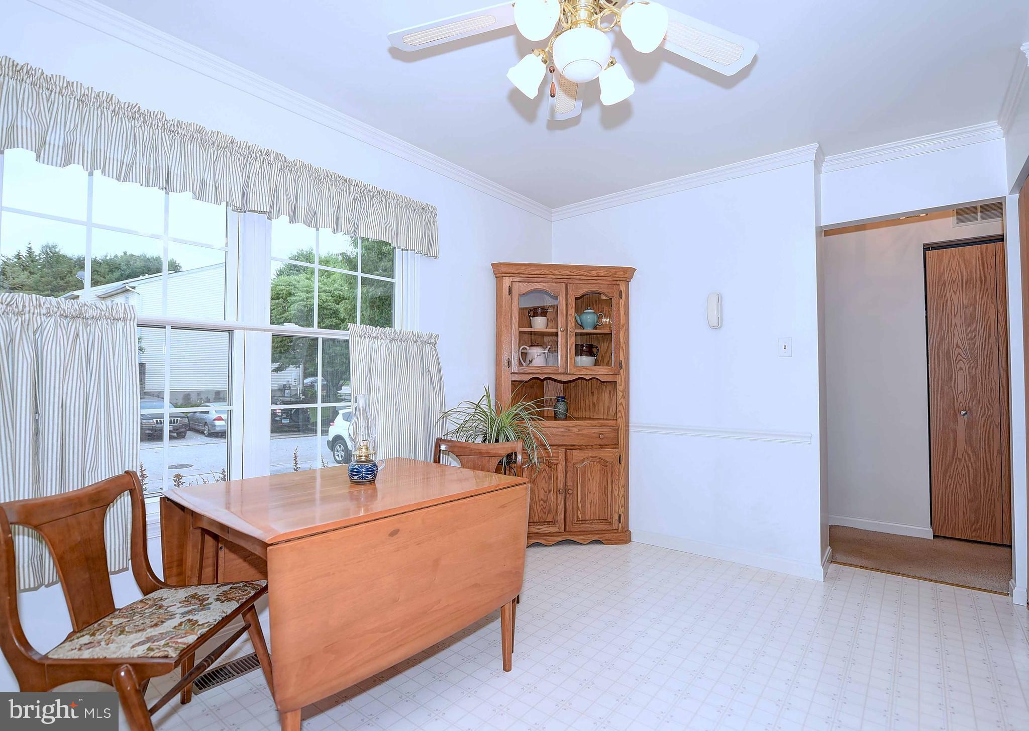 23 Offspring Court Perry Hall, MD 21128 - Photo 9 of 23 a living room with furniture a chandelier and a window