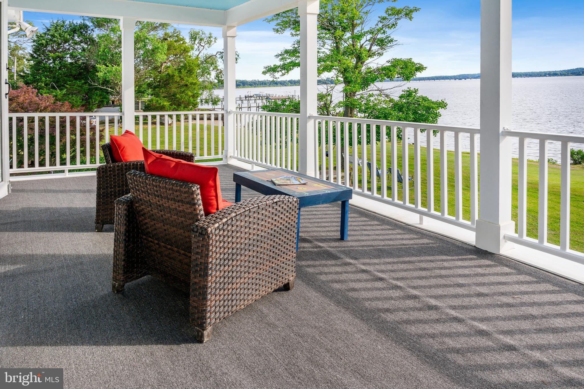5365 Buena Vista Road Prince Frederick, MD 20678 - Photo 11 of 74 a view of a deck with a floor to ceiling window and wooden fence
