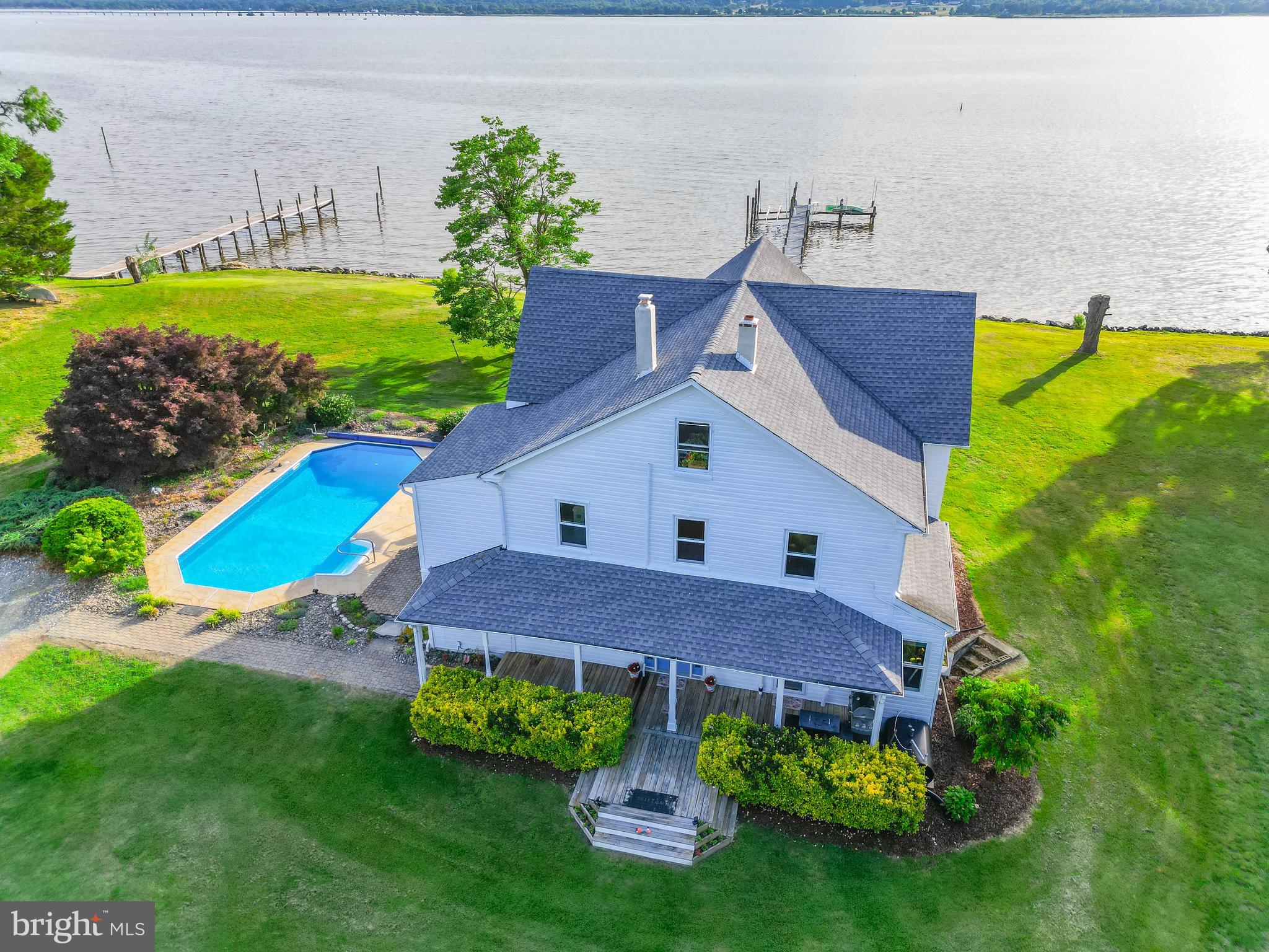 5365 Buena Vista Road Prince Frederick, MD 20678 - Photo 26 of 74 a front view of house with a yard and swimming pool
