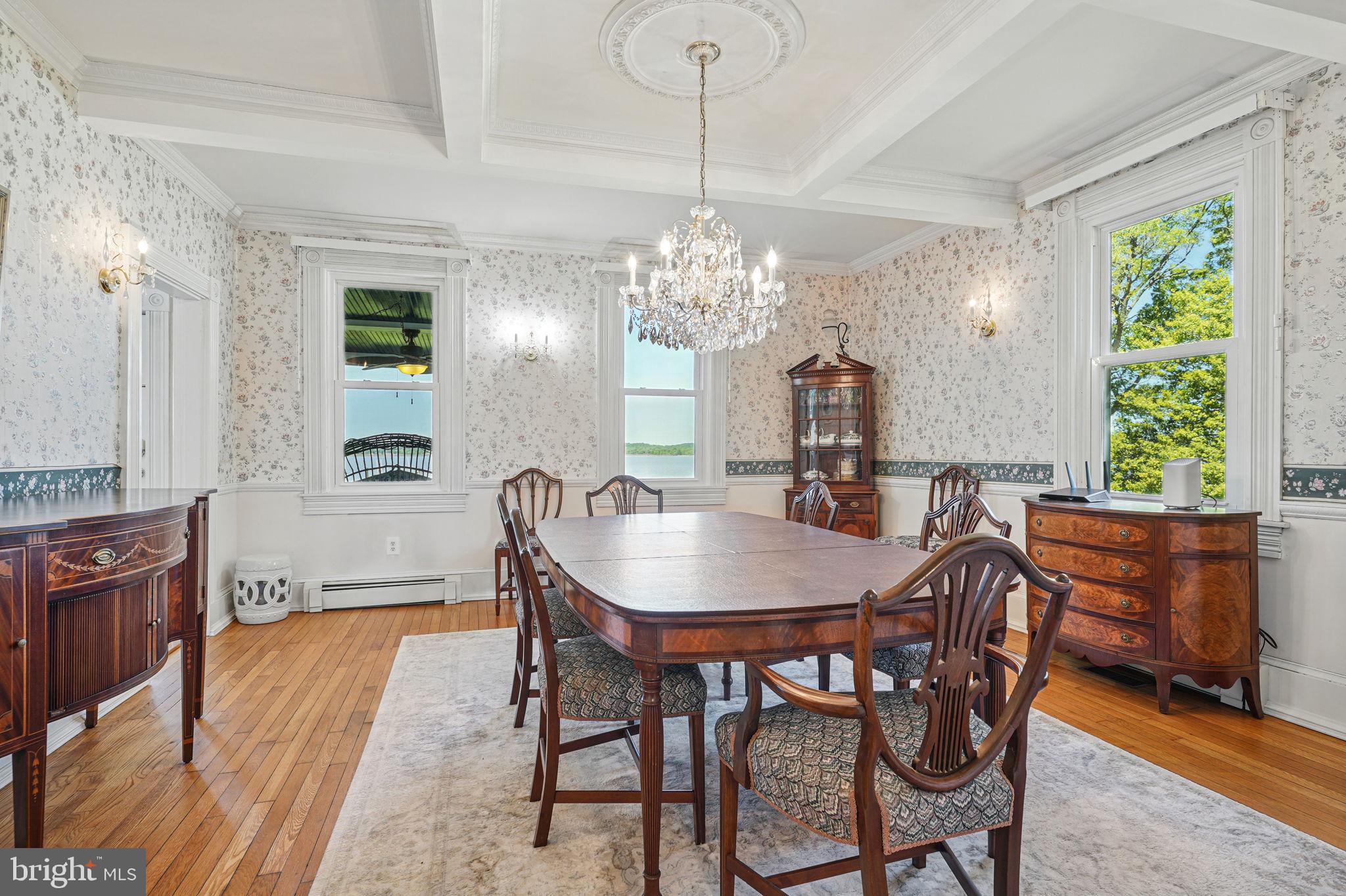 5365 Buena Vista Road Prince Frederick, MD 20678 - Photo 52 of 74 a dining room with furniture a chandelier and wooden floor