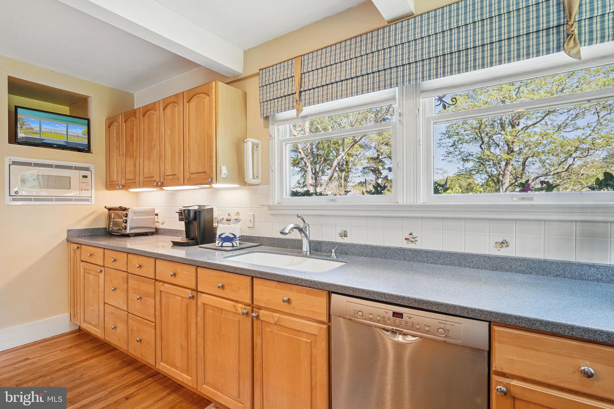 5365 Buena Vista Road Prince Frederick, MD 20678 - Photo 55 of 74 a kitchen with stainless steel appliances a sink dishwasher window and cabinets