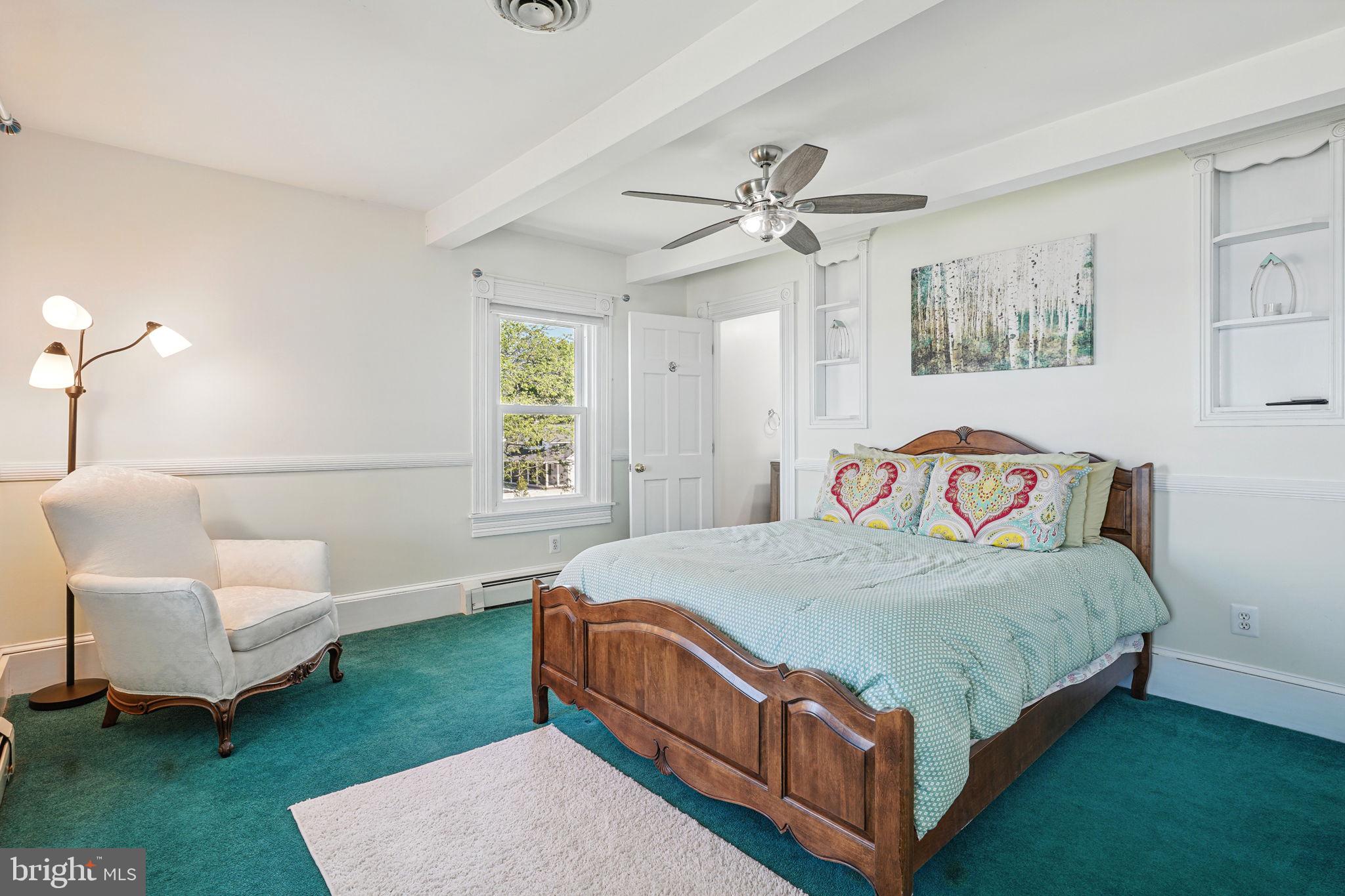 5365 Buena Vista Road Prince Frederick, MD 20678 - Photo 60 of 74 a bedroom with a bed a couch and a window