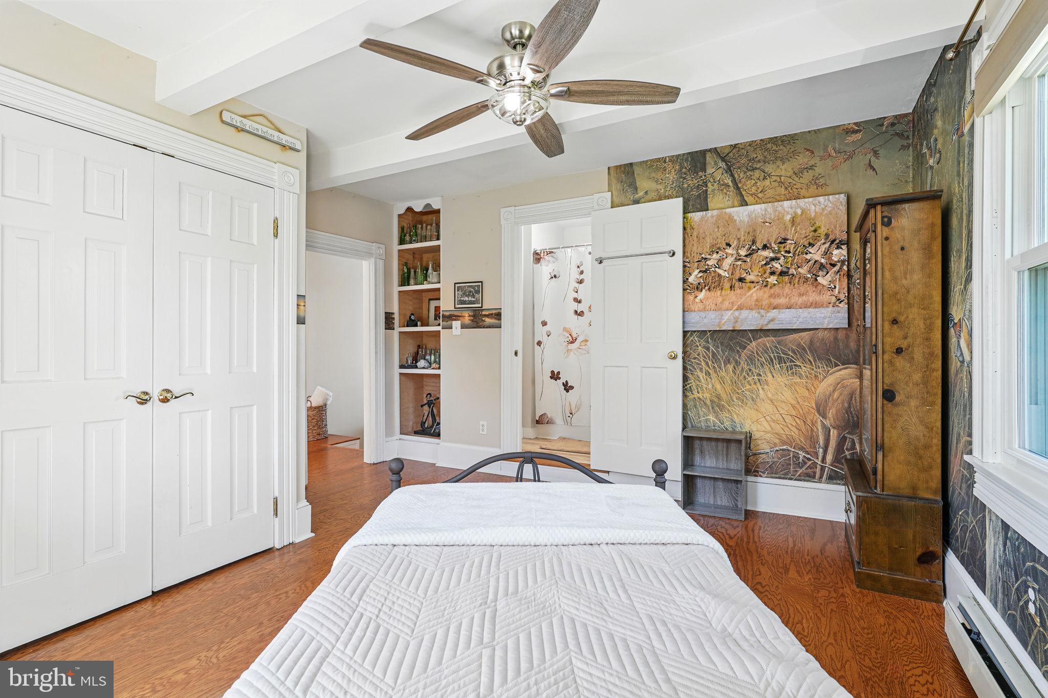 5365 Buena Vista Road Prince Frederick, MD 20678 - Photo 63 of 74 a bedroom with a bed and a chandelier