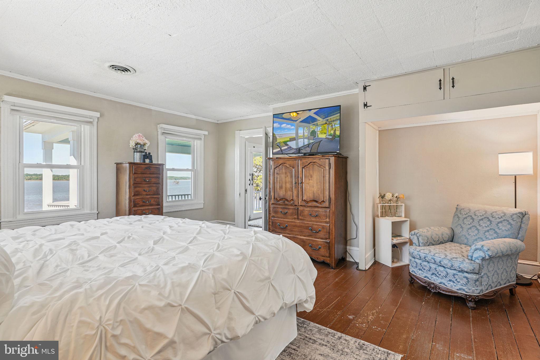 5365 Buena Vista Road Prince Frederick, MD 20678 - Photo 68 of 74 a spacious bedroom with a bed and a couch