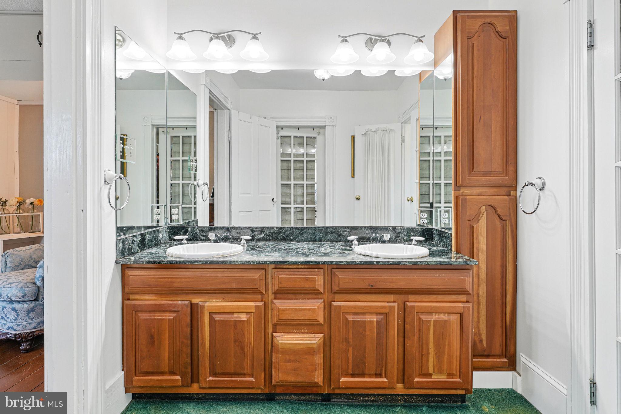 5365 Buena Vista Road Prince Frederick, MD 20678 - Photo 69 of 74 a bathroom with a granite countertop sink and a mirror
