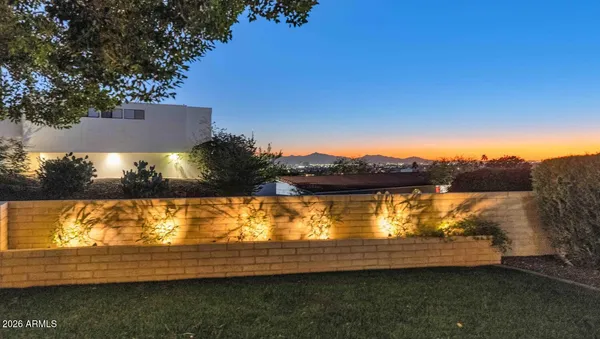 a view of a house with backyard