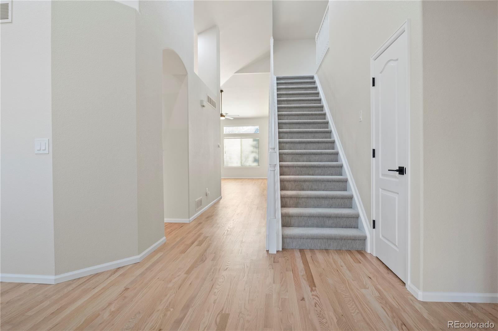 6900 West Grant Ranch Boulevard, Unit 53 Littleton, CO 80123 - Photo 12 of 31 a view of a hallway with wooden floor and entryway