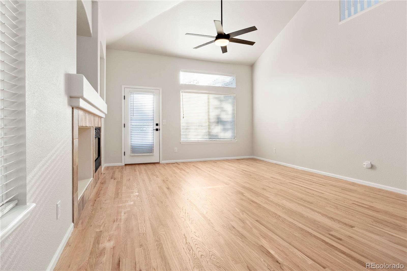 6900 West Grant Ranch Boulevard, Unit 53 Littleton, CO 80123 - Photo 17 of 31 a view of empty room with wooden floor and fan