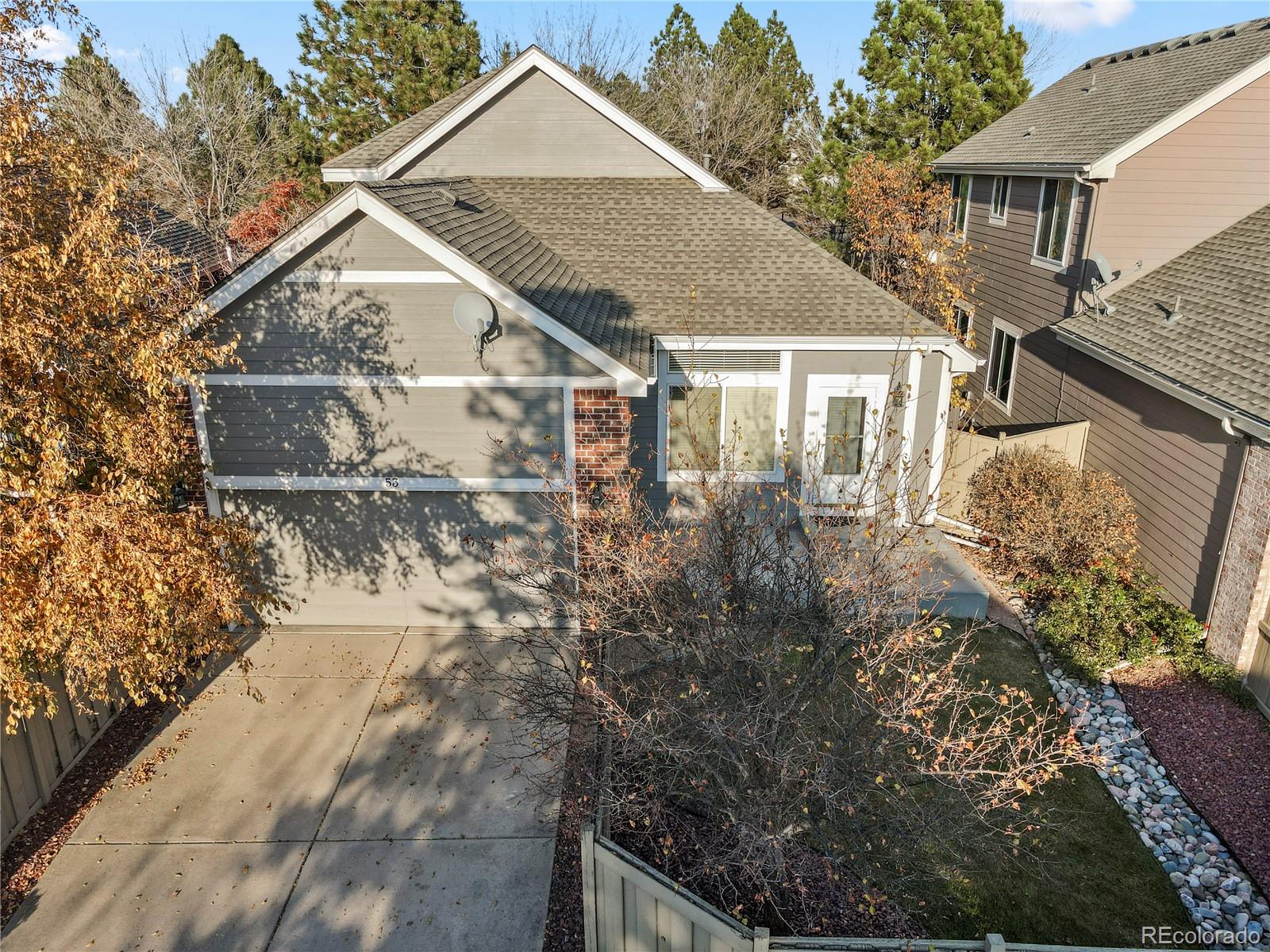 6900 West Grant Ranch Boulevard, Unit 53 Littleton, CO 80123 - Photo 28 of 31 a house with trees in front of it
