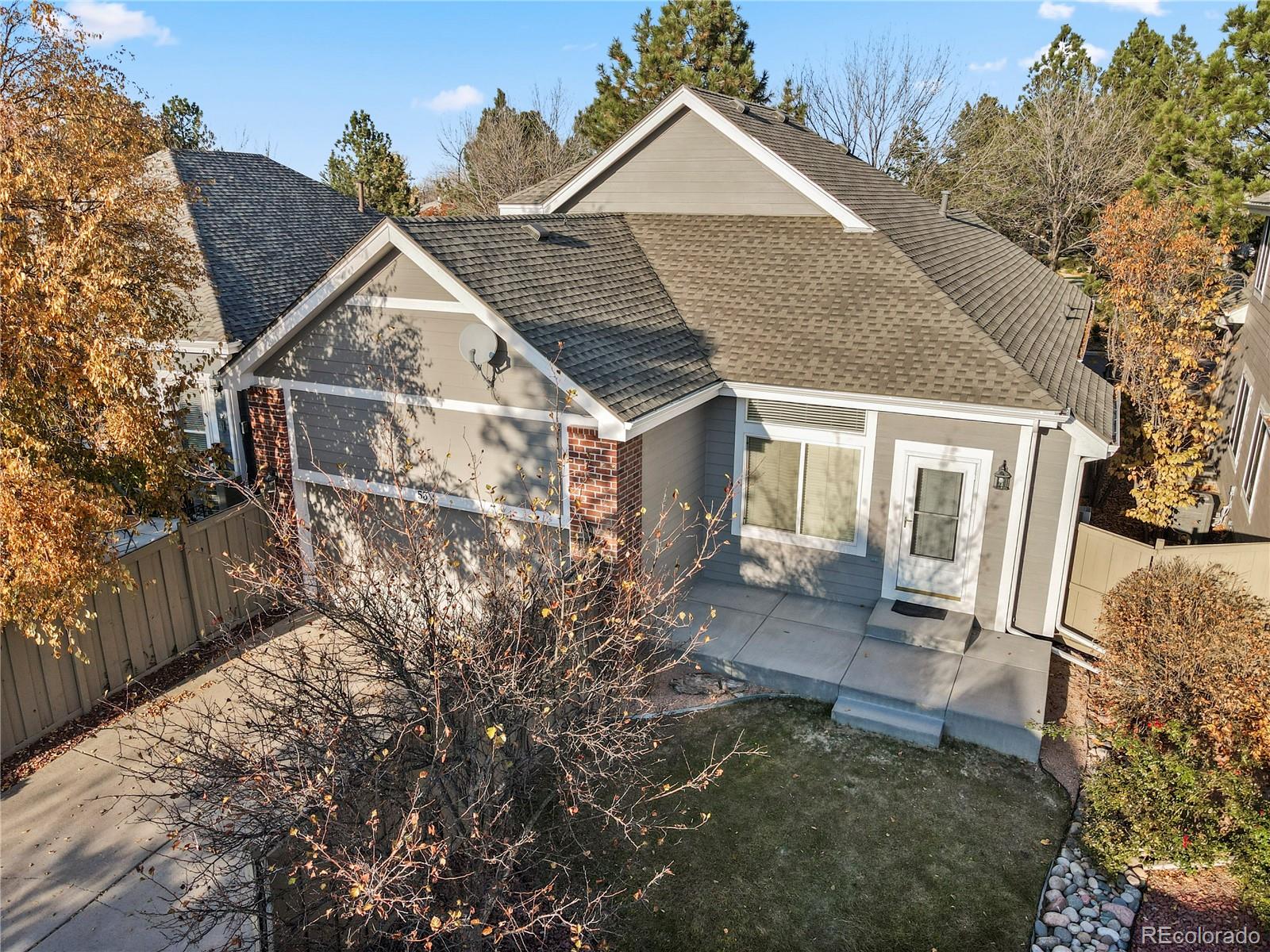 6900 West Grant Ranch Boulevard, Unit 53 Littleton, CO 80123 - Photo 29 of 31 front view of a house with a yard