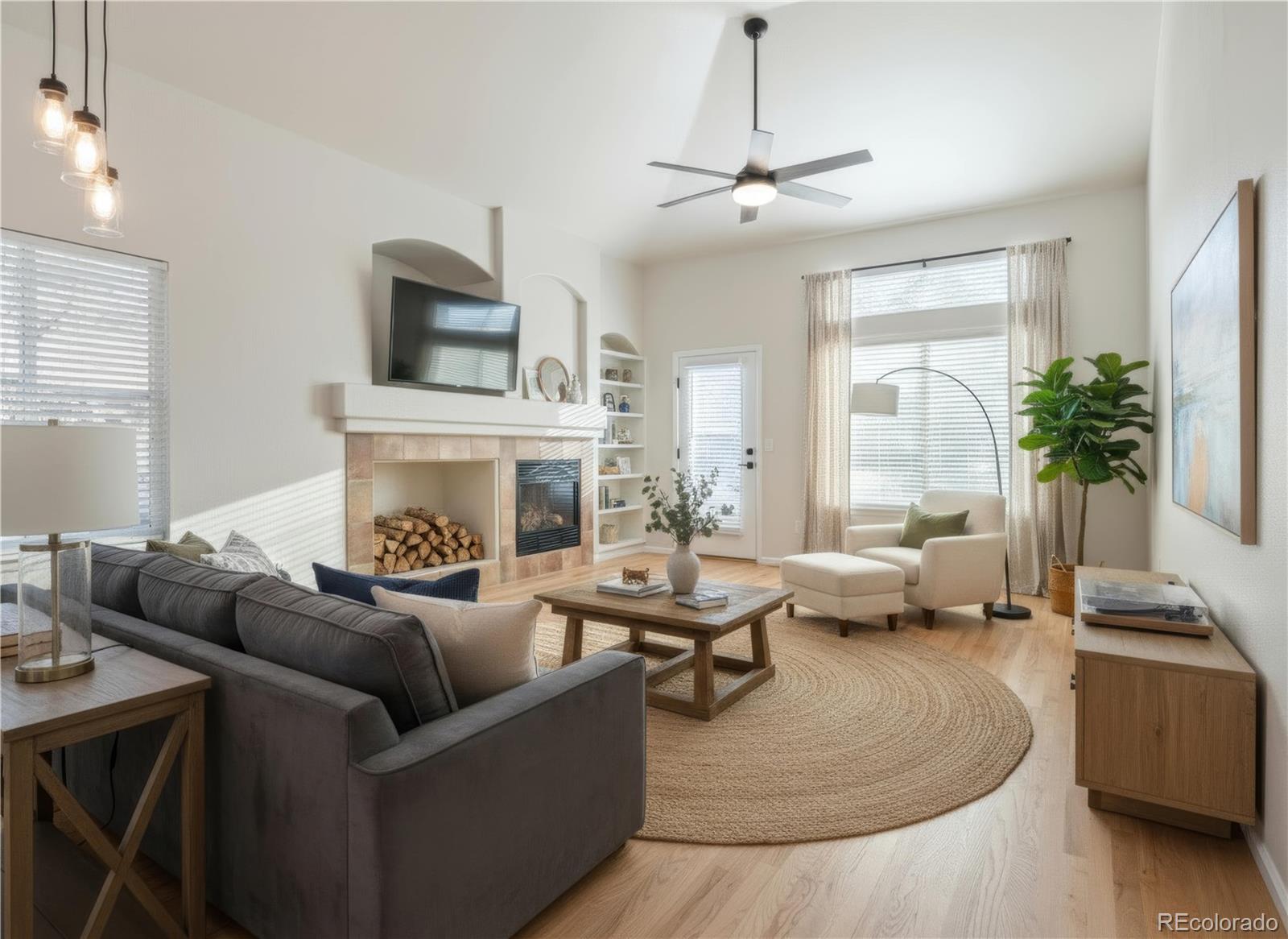 6900 West Grant Ranch Boulevard, Unit 53 Littleton, CO 80123 - Photo 5 of 31 a living room with furniture and a fireplace