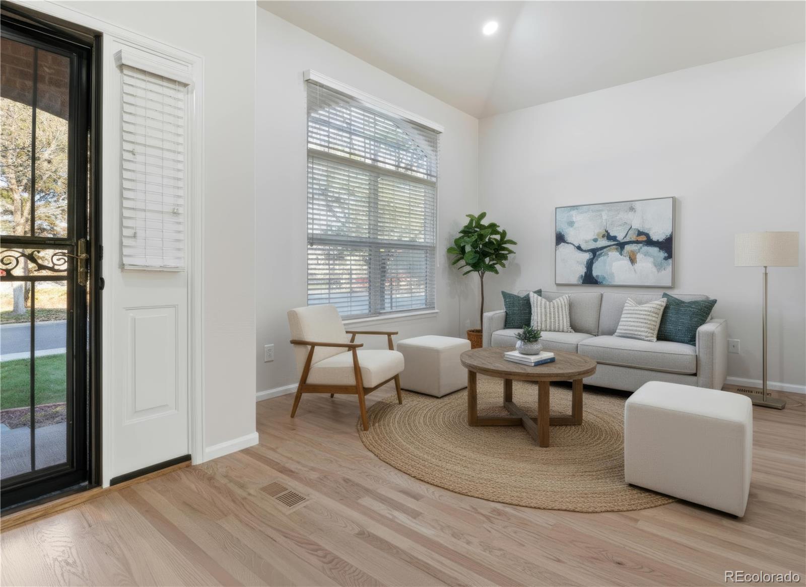 6900 West Grant Ranch Boulevard, Unit 53 Littleton, CO 80123 - Photo 7 of 31 a living room with furniture and a window