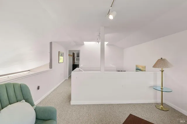 a bathroom with a sink shower and a mirror