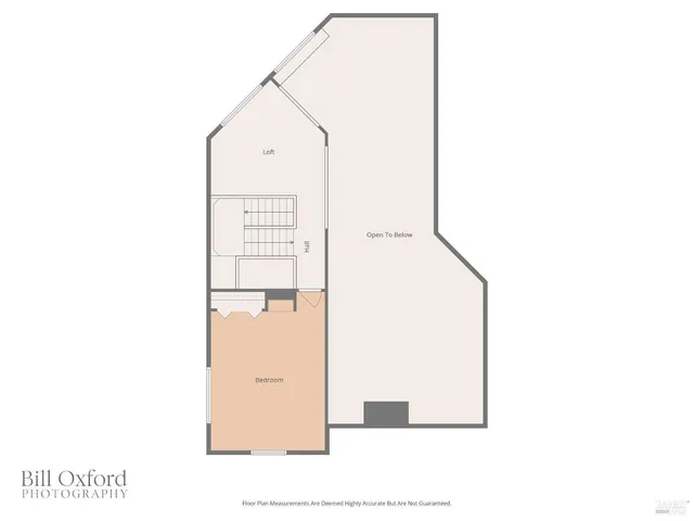 a bedroom with a bed and a large mirror