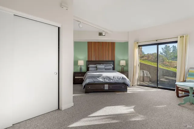 a bathroom with a double vanity sink a toilet and a mirror