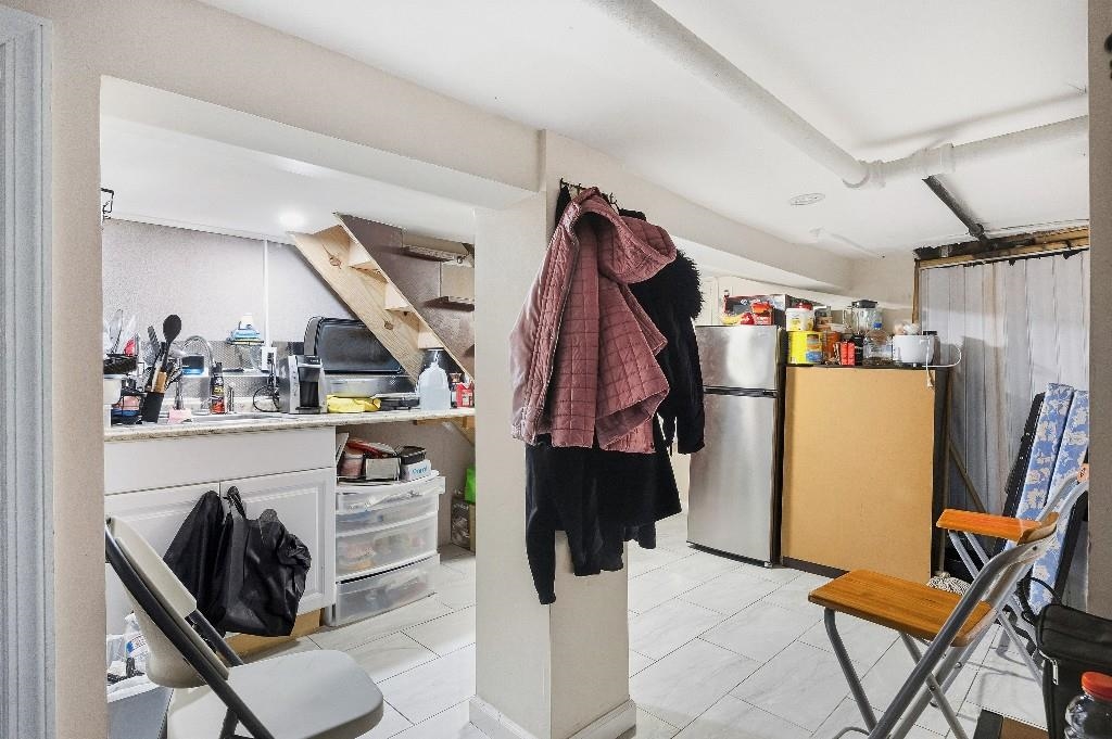 383 Broadway Passaic, NJ 07055 - Photo 15 of 21 a view of walk in closet with clothes and shoes