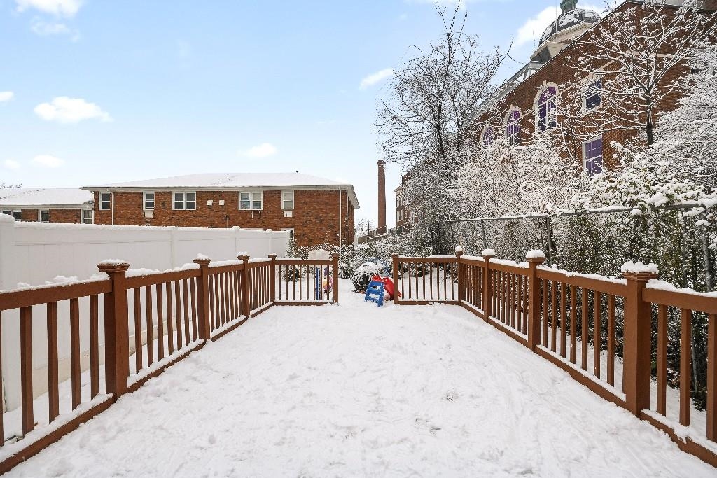 383 Broadway Passaic, NJ 07055 - Photo 19 of 21 a balcony view with two chairs and a table