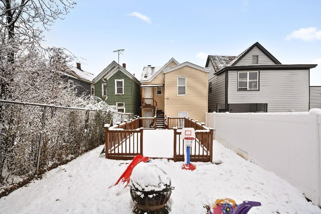 383 Broadway Passaic, NJ 07055 - Photo 20 of 21 a front view of a house with a yard
