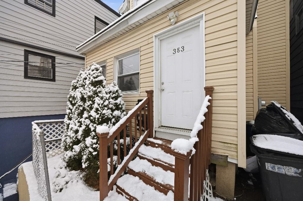 383 Broadway Passaic, NJ 07055 - Photo 2 of 21 a front view of a house with lots of green space