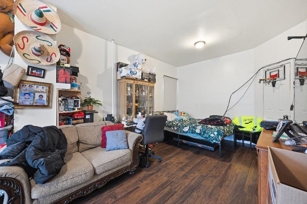 383 Broadway Passaic, NJ 07055 - Photo 7 of 21 a living room with furniture and a wooden floor