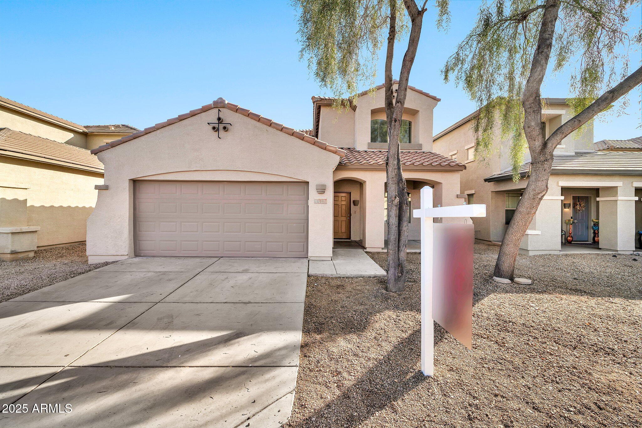 9437 West Berkeley Road Phoenix, AZ 85037 - Photo 1 of 21 a view of a house with a yard and garage