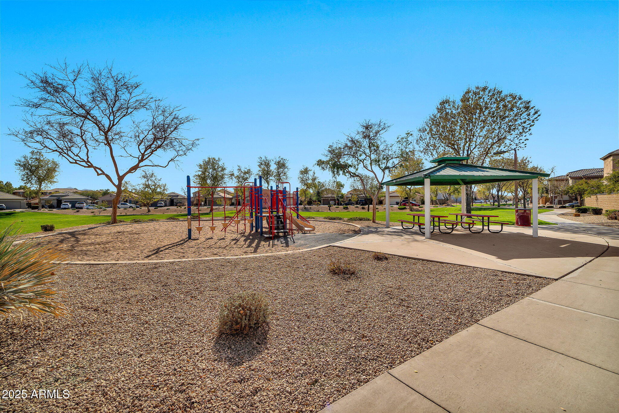 9437 West Berkeley Road Phoenix, AZ 85037 - Photo 18 of 21 a view of a park with swings and slides