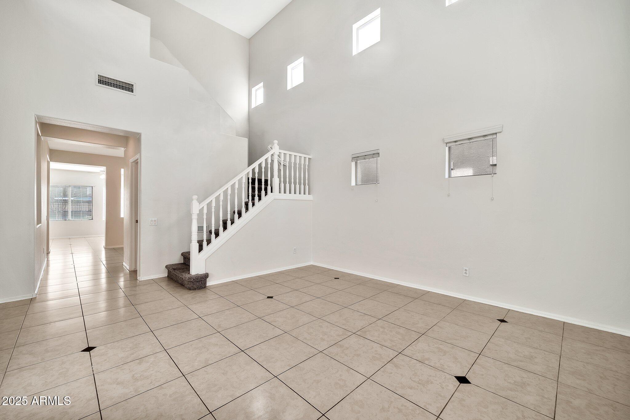 9437 West Berkeley Road Phoenix, AZ 85037 - Photo 2 of 21 a view of an entryway with wooden floor
