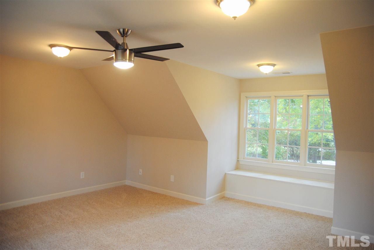2004 Vintners Court Raleigh, NC 27610 - Photo 13 of 16 an empty room with a window and a fan
