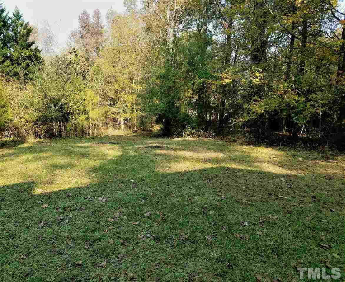 2004 Vintners Court Raleigh, NC 27610 - Photo 14 of 16 a view of a large yard with large trees