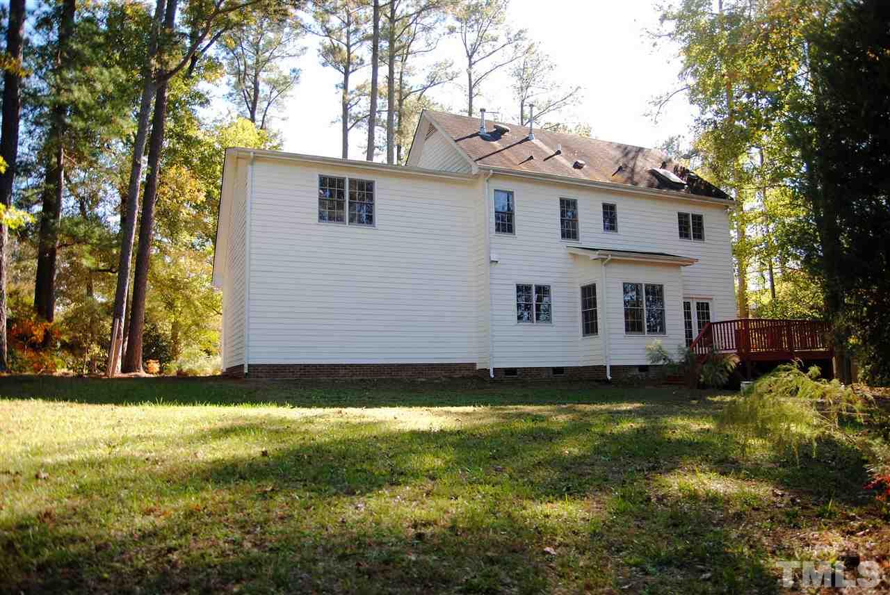 2004 Vintners Court Raleigh, NC 27610 - Photo 15 of 16 a view of a house with a yard and sitting area