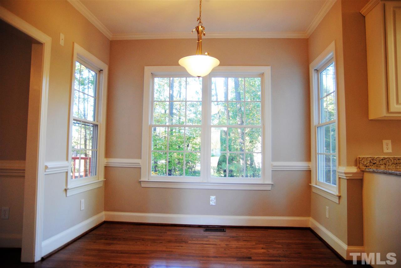 2004 Vintners Court Raleigh, NC 27610 - Photo 6 of 16 a view of an empty room with wooden floor and a window