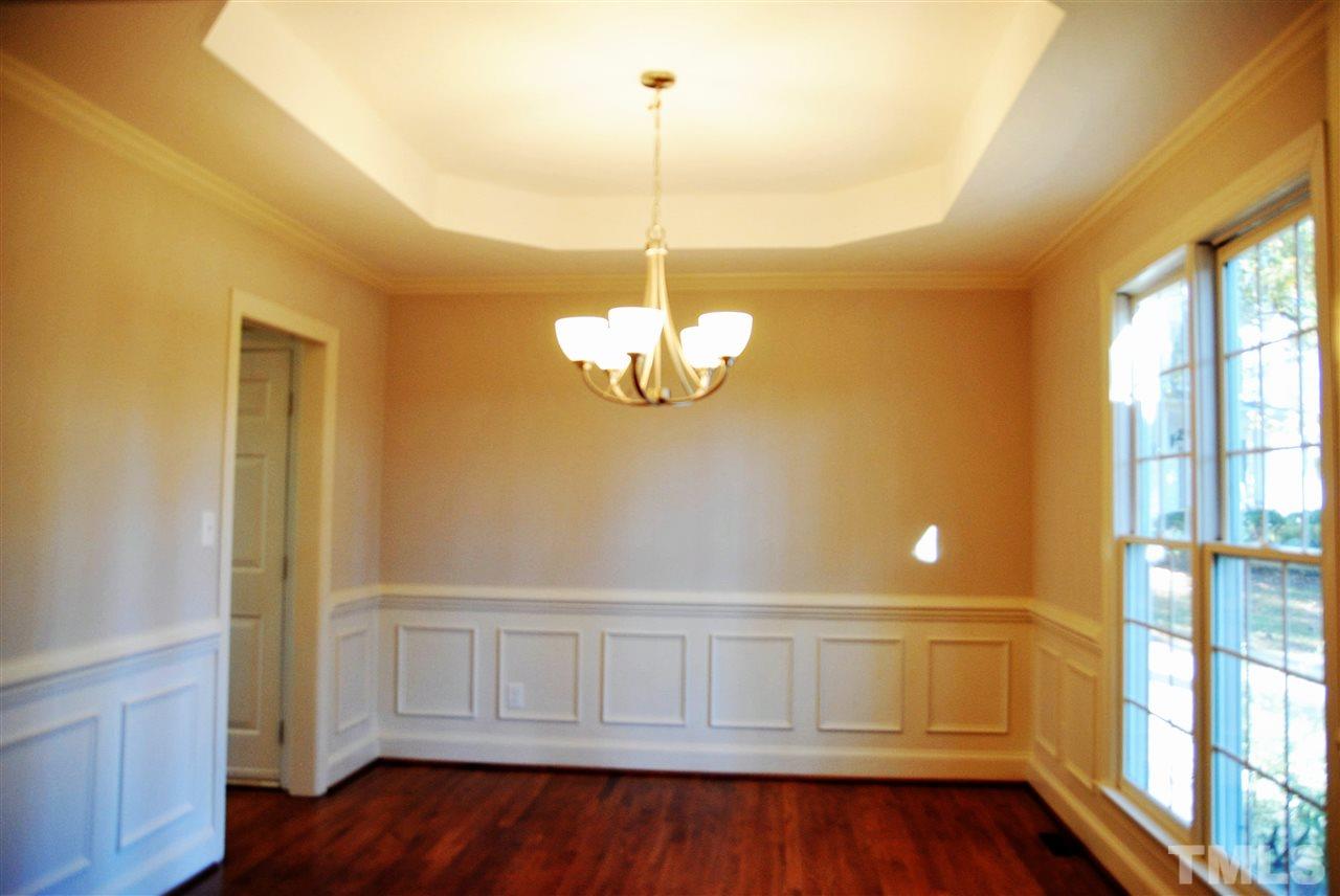 2004 Vintners Court Raleigh, NC 27610 - Photo 7 of 16 a view of an empty room with wooden floor and a window