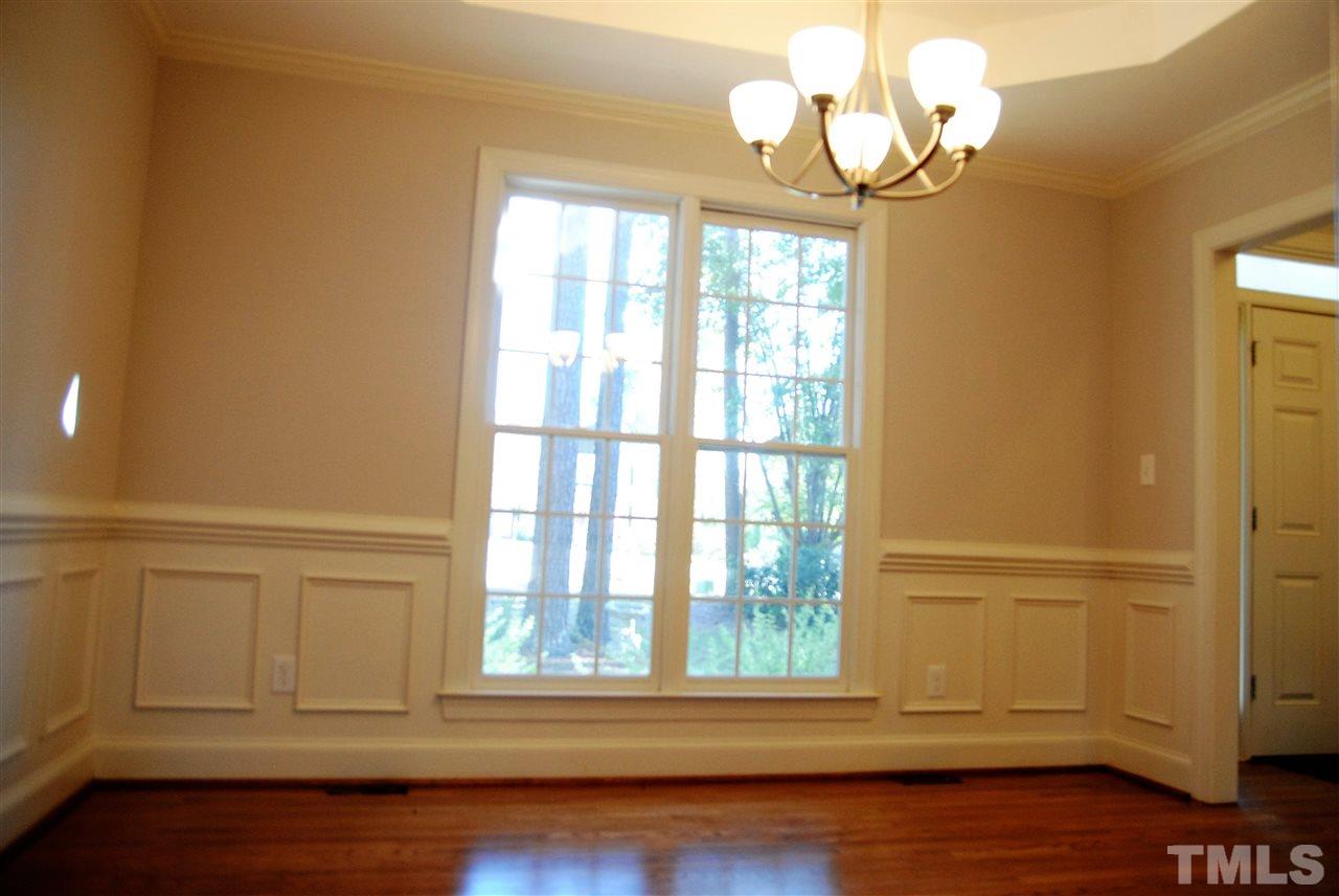 2004 Vintners Court Raleigh, NC 27610 - Photo 8 of 16 a view of a livingroom with wooden floor and a large window