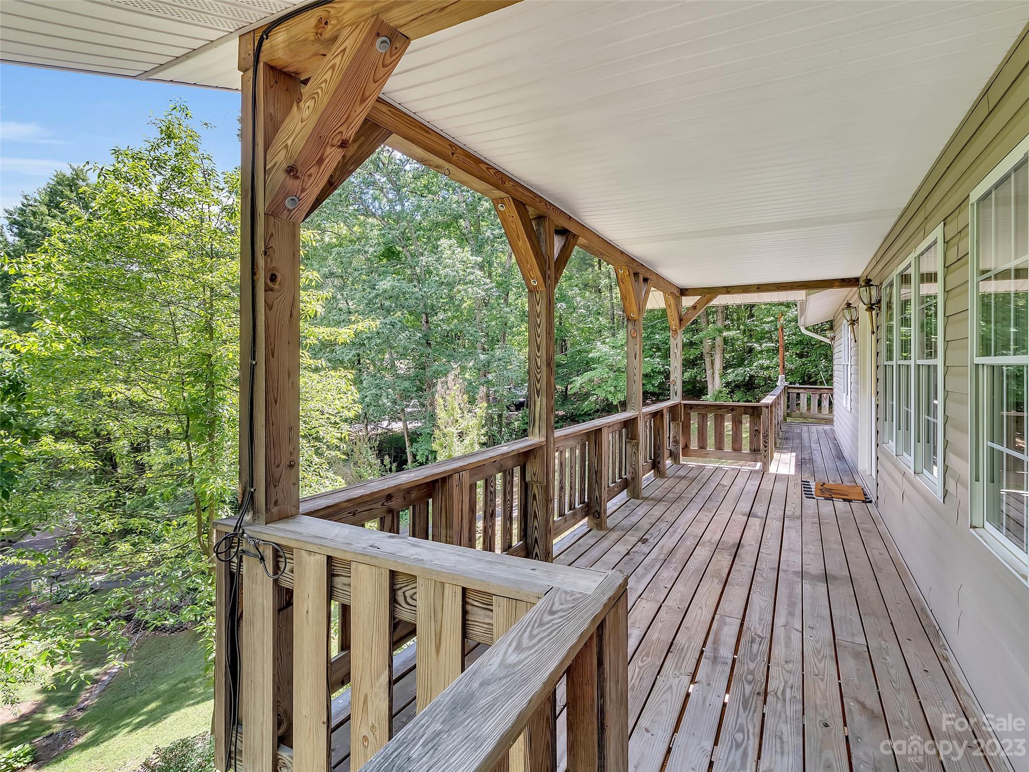 799 Nellie John Drive Clyde, NC 28721 - Photo 11 of 38 a view of balcony with wooden floor
