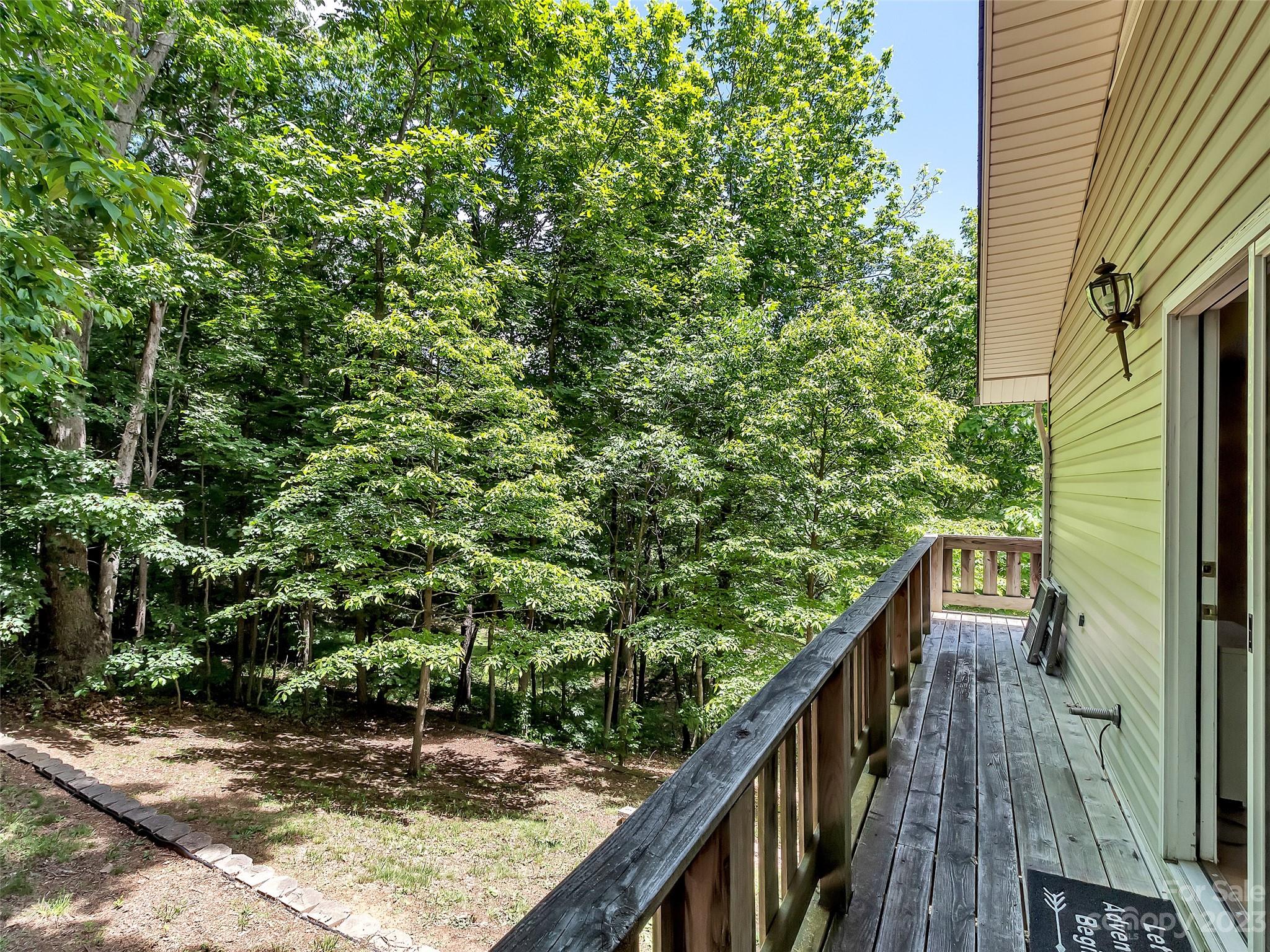 799 Nellie John Drive Clyde, NC 28721 - Photo 14 of 38 a view of balcony with wooden floor and fence