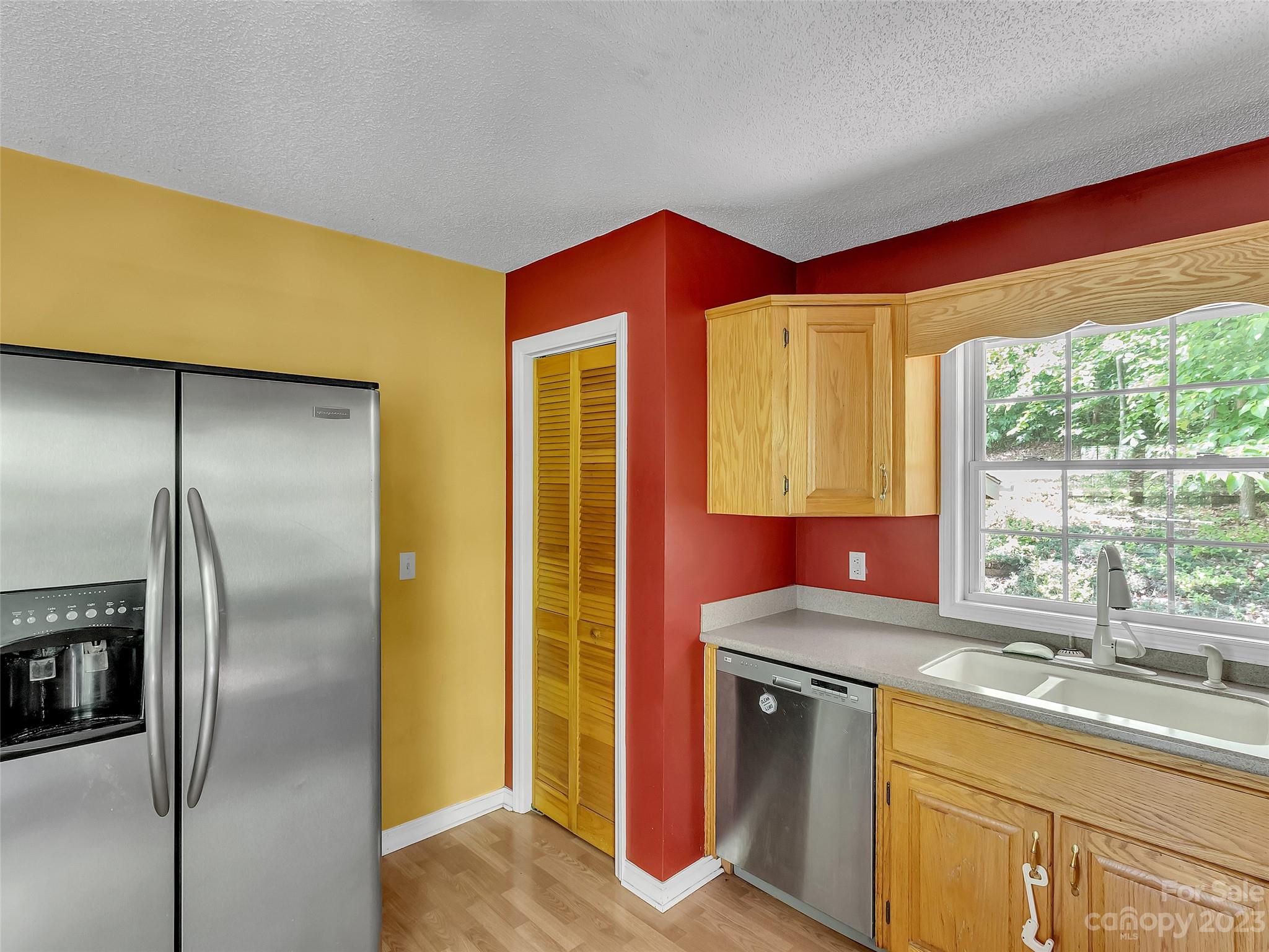 799 Nellie John Drive Clyde, NC 28721 - Photo 17 of 38 a kitchen with a refrigerator and a sink