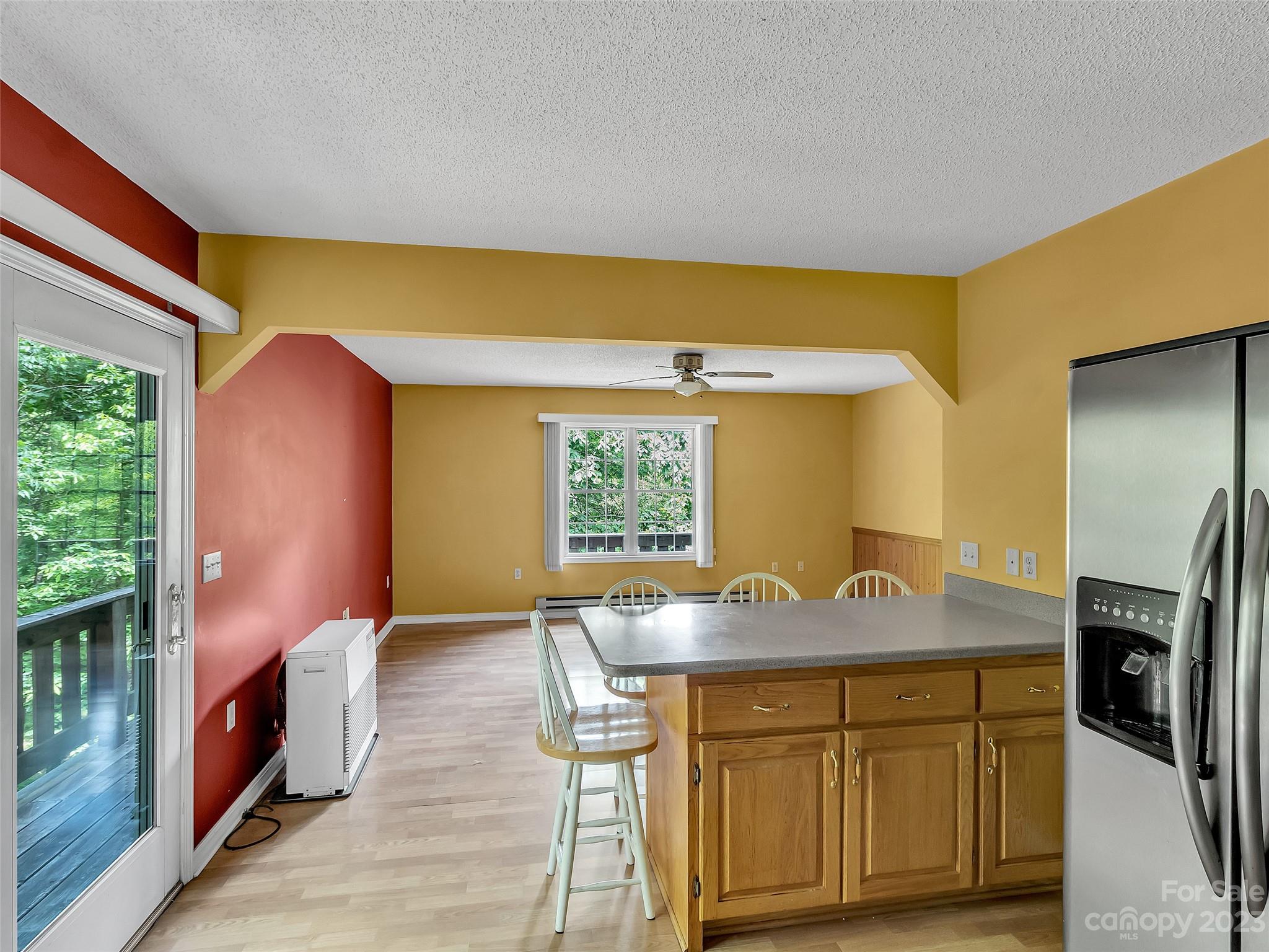 799 Nellie John Drive Clyde, NC 28721 - Photo 18 of 38 a kitchen with stainless steel appliances granite countertop a sink a stove and refrigerator