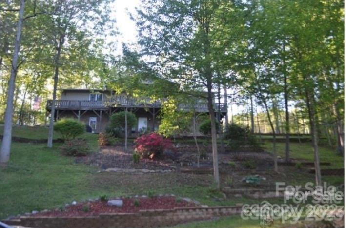 799 Nellie John Drive Clyde, NC 28721 - Photo 2 of 38 a view of a chair and table in backyard of the house