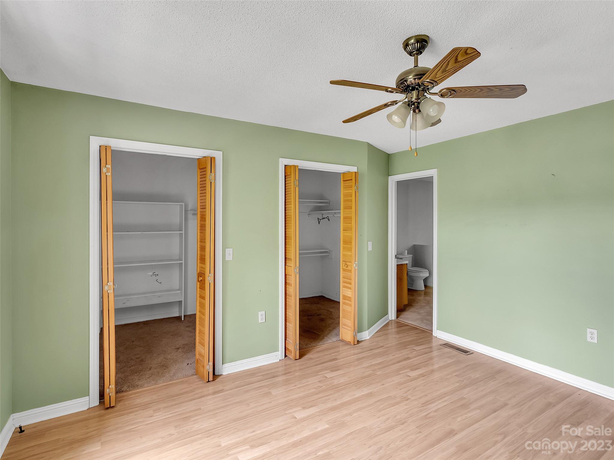 799 Nellie John Drive Clyde, NC 28721 - Photo 28 of 38 a view of a room with wooden floor closet and windows