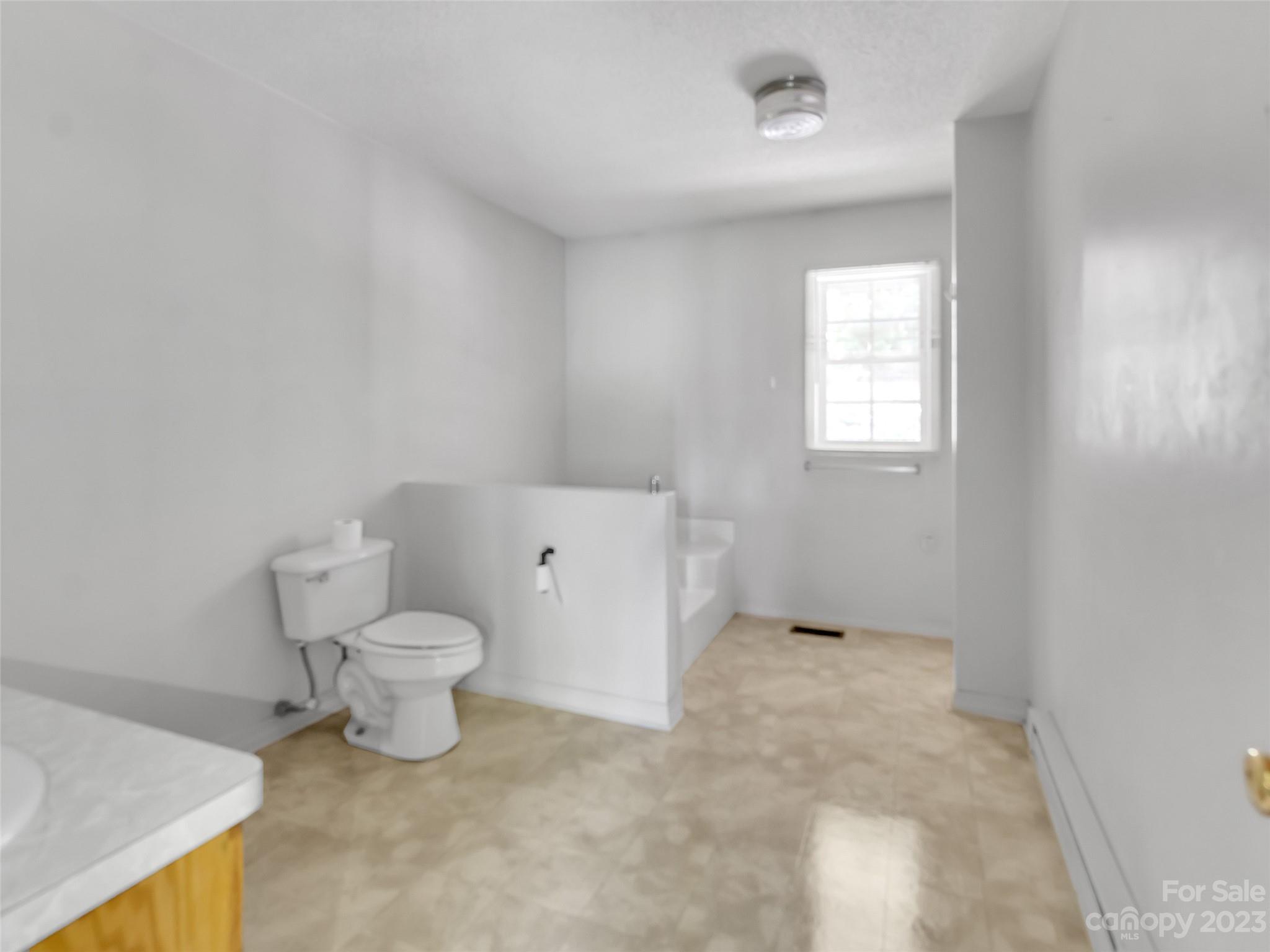 799 Nellie John Drive Clyde, NC 28721 - Photo 29 of 38 a bathroom with a toilet