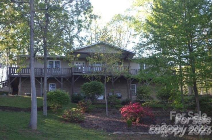 799 Nellie John Drive Clyde, NC 28721 - Photo 3 of 38 a front view of a house with garden