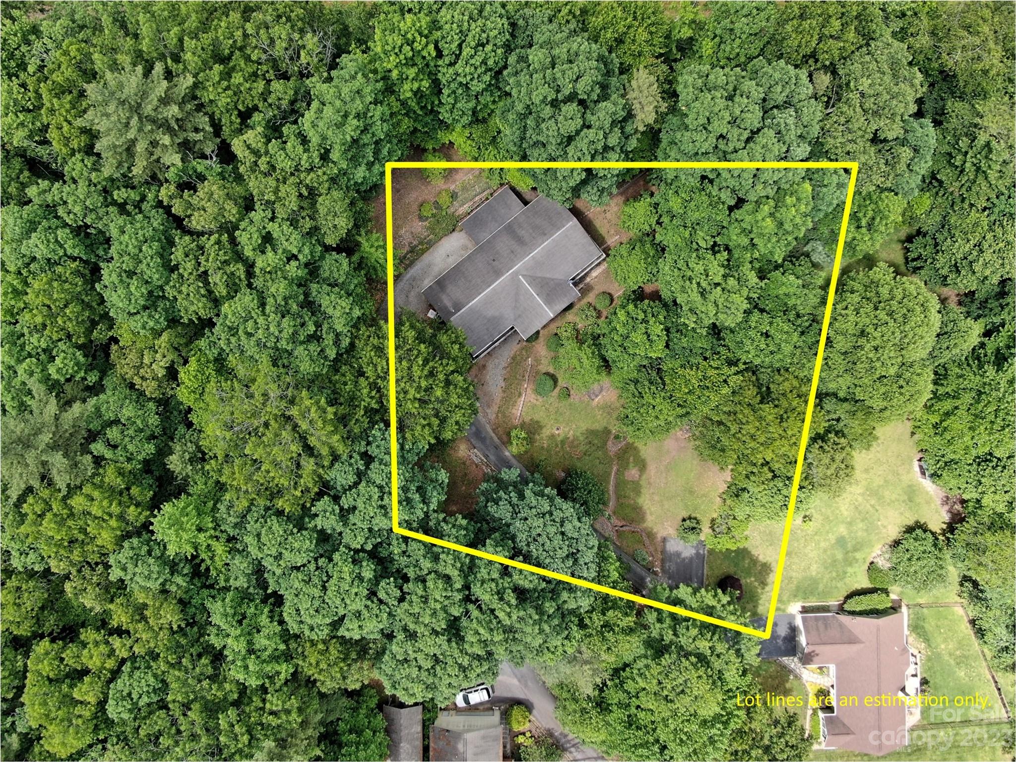 799 Nellie John Drive Clyde, NC 28721 - Photo 36 of 38 an aerial view of a house with a yard and lake view